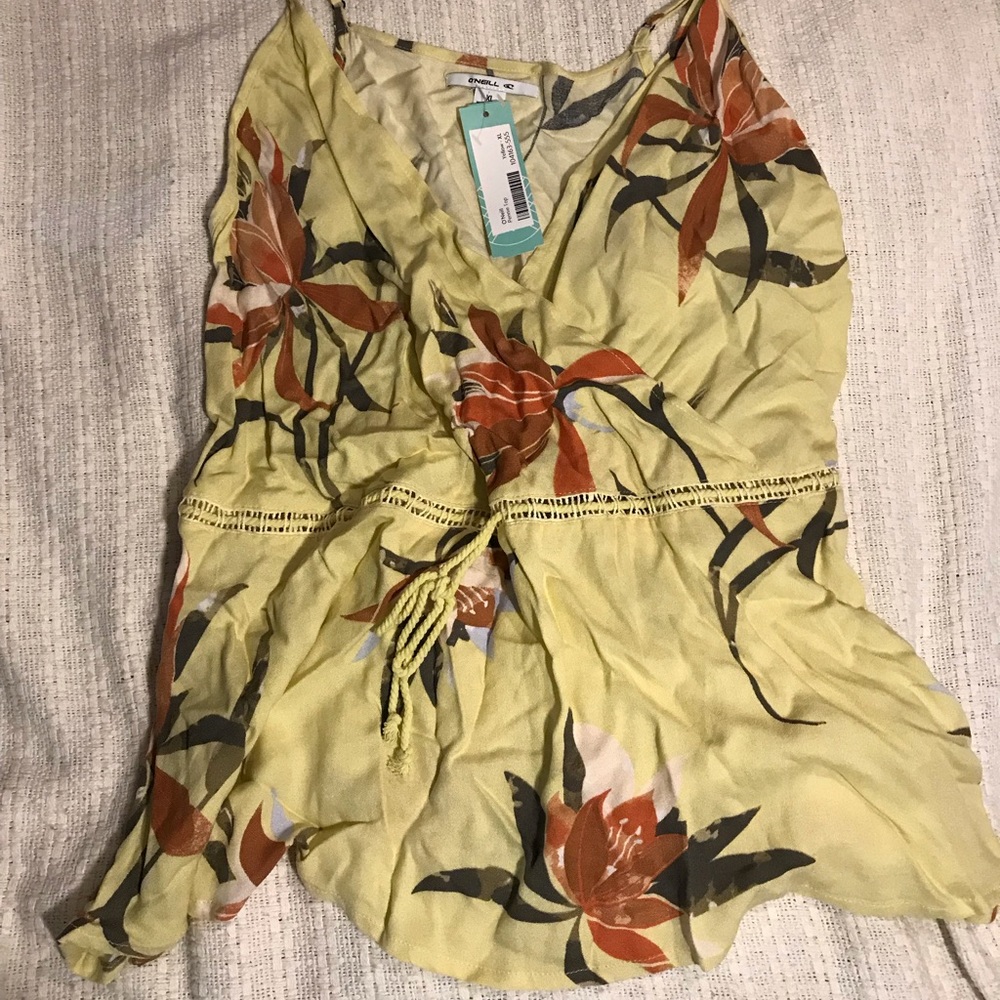 Yellow sleeveless top with floral pattern